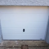 Installation d'une porte de garage sectionnelle Dégriff Fenêtres